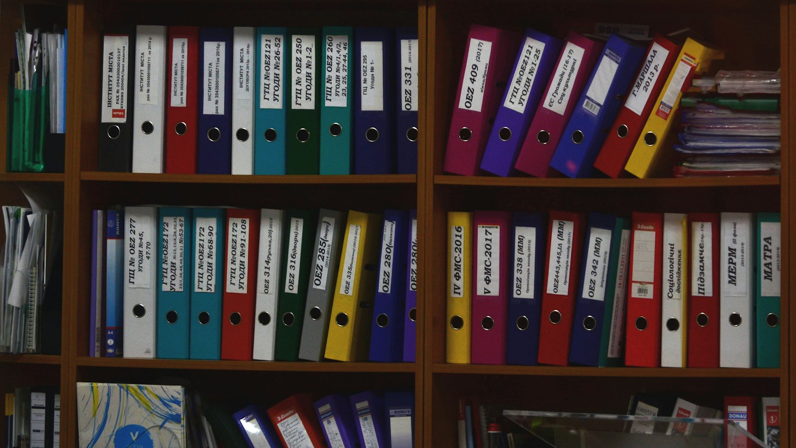 Shelves of colour-coded document binders